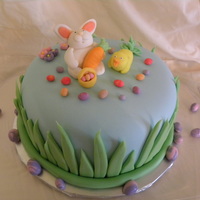 Easter Bunny Cake Gluten-free vanilla cake filled with raspberry buttercream and covered in buttercream and MMF. Fondant figures. Inspired by many cakes on...