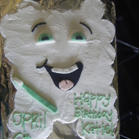 Tooth Cupcake Cake its a tooth cupcake cake i made, buttercream frosting with fondant for the face and the tooth brush!