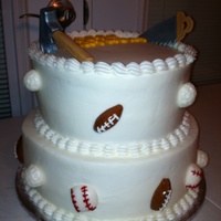 Birthday Cake Moist yellow cake with bavarian cream. Accents are rolled buttercream. Gumpaste saw & hammer. Letters are white chocolate.