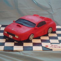 Ferrari Cake Ferrari Groom's cake. Peanut Butter Chocolate Chip cake w/ Cookies n' Creme filling. Lots of fun to make! Thanks for looking.