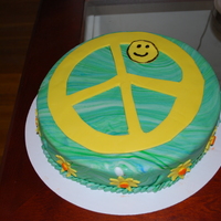 Savannah's Birthday Cake The birthday girl wanted blue, green and a peace sign. She was thrilled when she saw this!
