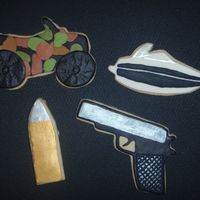 Gun, Boat, Bullet & Quad Cookies Made these for my dad's birthday. They represented all of his favorite hobbies! TFL!!
