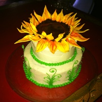 Sunflower Birthday Cake Chocolate espresso cake with caramel buttercream. The sunflower is made of chocolate modeling clay and gumpaste.