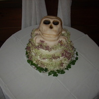 Skull & Crossbones Wedding Cake Couple wanted my traditional chocolate wedding cake with real buttercream frosting but with the top to be a skull. Skull is covered in...