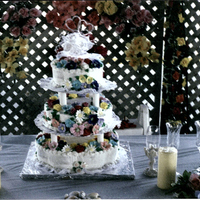 Flowers Everywhere I used petal pans 15", 12", 6". Pineapple flavored Buttercream icing, White cake flavored with pineapple, and Pineapple...