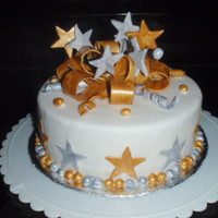 New Year 2010 This is a vanilla butter cake with vanilla butter cream frosting and a strawberry glaze.Covered in fondant and all decorations are fondant...