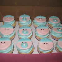 Baby Boy Cupcakes For Baby Shower I made these for a woman having a company baby shower. The babies are fondant and the cupcakes are WASC with vanilla bc frosting!