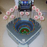 Yankee Stadium I made this for my son' s baseball banquet. It's carved out of three 16 inch square cakesand decorated with BC, fondant and base...