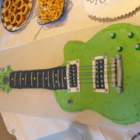 Guitar Groom's Cake Cake made for my niece's wedding groom cake. Chocolate cake with peanut butter cream frosting. The neck of the guitar is made of rice...