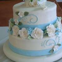 Topiary Rose Cake This cake was inspired by one of Edna de la Cruz's creations. Fondant finish, gumpaste roses, blossoms and details.