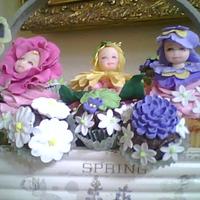 Cup Kids Child head mold used to create faces with flowers added to reflect the work of Anne Geddes child photography. Cupcake bouquet is good for...