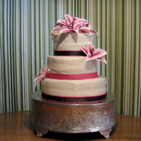 Wedding Vow-Renewal Cake Bottom tier, strawberry cake. Two upper tiers, white cake. Covered in BC with sugar flowers and ribbon. Read my blog to hear the disaster...