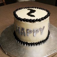 Michael Jackson Birthday Cake Chocolate cake with cream cheese icing. MJ and decorations made with fondant.