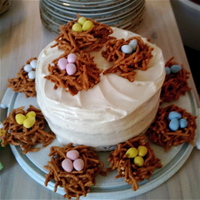 Easter Carrot Cake Carrot cake with cream cheese icing. Nests made of butterscotch, chow mein noodles, and chocolate eggs. Hope you enjoy!