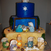 Nativity Cake Iced in buttercream, brown sugar sand, gumpaste/fondant figures.