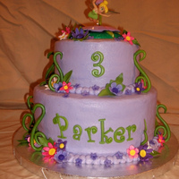 Tinkerbell Cake Iced in buttercream with gumpaste flowers and fondant vines.