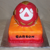 Bakugan Cake Iced in buttercream with fondant Bakugan pieces and letters.