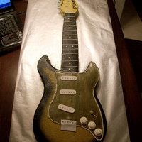 Guitar Cake Iced in buttercream with fondant accents.