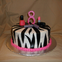 Zebra Print Fashionista Cake Iced in buttercream with fondant zebra print and makeup.