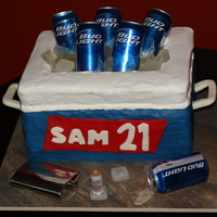 21St Birthday Four 12x18 stacked and carved WASC. Iced in buttercream. Name sign and handles made out of MMF. Isomalt ice cubes formed in silicone molds...
