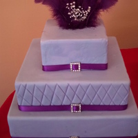 Purple Sweet 16 this was a sweet 16 purple cake! feather's on top!!