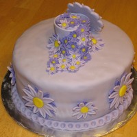 Purple Daisies This cake was for my last Wilton class ever. I really like the two-toned purple daisies. Overall, I am really happy with the results.