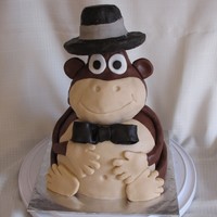 Monkey Cake Chocolate cake with chocolate fondant. Accents are all fondant. The head and hat are RKT. This was my first 3D cake and I'm pretty...