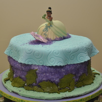 Princess And Frog This is my first fondant cake. So here's the story...The cake was first covered in purple fondant. When I covered it, there were so...