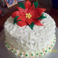 Christmas W/ Fondant Poinsetta cake was layered red velvet cake and cheesecake,poinsetta is made out of fondant