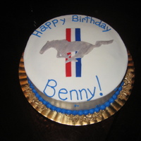 Mustang Emblem I used fondant for the actual emblem. I used a silver dusting powder for the mustang. The rest of the cake is covered and decorated with...