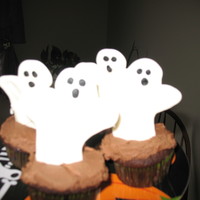 Ghost Cupcakes My sons birthday is in October and he wanted a halloween the cupcakes he took to school. I found a ghost shape I liked on line and printed...