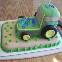 John Deere Tractor Cake A yellow Cake with raspberry cream cheese frosting. The wheels are make of donuts. It was big hit!