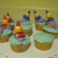 Clowns To Left Of Me, Jokers To The Right, Here I Am... From my Wilton class, some clown cupcakes. The ride home, wsn't friendly to these little guys.