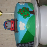 Thomas The Train Cake This cake was for a a little boy turning 4. Thomas, the sign and the rocks around the tunnel are gumpaste. The rest is fondant.