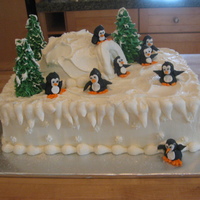 Penguins In Winter buttercream icing, royal icing penguins and trees