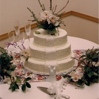 Oval Stacked Wedding Cake . Butter cream sottas with fondant aisle