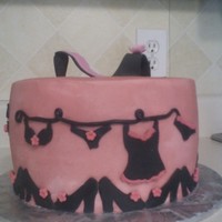 Bridal Shower Cake Chocolate cake iced with buttercream. Fondant accents with a gumpaste shoe.