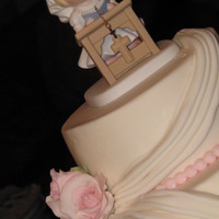 Olivia 1St Communion 6" & 9" round with gumpaste roses and precious moments cake topper.