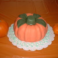 Pumpkin Party Cake Two bundt cakes stacked on one another and covered in marshmallow fondant.