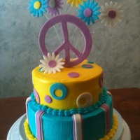 Peace & Posies two tiered cake with buttercream and decorated in fondant