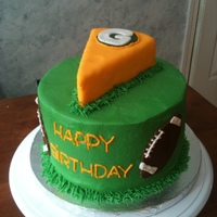 Cheesehead! White cake covered in buttercream with a fondant piece of cheese on top