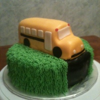 1St Day Of School white cake with a reice krispie shaped bus covered in fondant