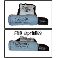 Chopin Cake Happy Birthday JB! RKT bottle of Chopin sitting in front of a black pillow with a small white blanket on top. Pillow is lemon pound cake...