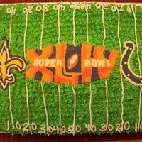 Superbowl 44...go Saints! All buttercream. Used the FBCT technique for the first time. Icing turned out to be a little too runny, but ended up with a great effect!