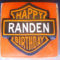 Harley Birthday cake for my friend's husband, who drives and loves Harley's. Top tier is Chocolate cake with milk chocolate ganache...