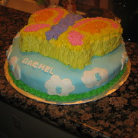 Butterfly Birthday Cake I made this cake with a 14" round cake on bottom covered in buttercream, and then a layer of MMF. The clouds, letters, and numbers (5...