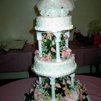 Very First Wedding Cake BC icing, edible pearls, silk flowers. Bottom 12" layer has bouquet flavoring, middle 10" layer is vanilla & almond, top is 8...