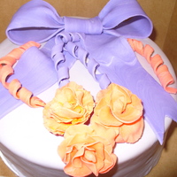 First Fondant Roses MMf covered cake with fondant bow and roses first time making bow and roses.