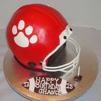 Football Helmet Four layers of cake carved to almost look like a helmet. My first football helmet and I had fun creating it.