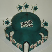 Baseball Hat Cake 2layer cake on bottom and chocolate hat cake.